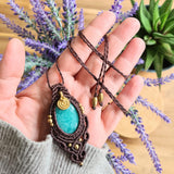 Handcrafted macramé pendant with an Amazonite gemstone centerpiece and brass details, perfect as a gift from a small business for hippie, and wellbeing-focused clients.