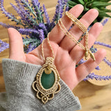 Handcrafted macramé pendant with an Aventurine gemstone centerpiece and brass details, perfect as a gift from a small business for hippie, and wellbeing-focused clients.