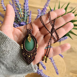 Handcrafted macramé pendant with an Aventurine gemstone centerpiece and brass details, perfect as a gift from a small business for hippie, and wellbeing-focused clients.