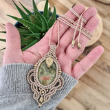 Handcrafted macramé necklace with an Unakite gemstone centerpiece and brass details, perfect as a gift from a small business for hippie, and wellbeing-focused clients.