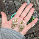 Handcrafted macramé earrings with brass details, perfect as a gift from a small business for hippie, and wellbeing-focused clients.