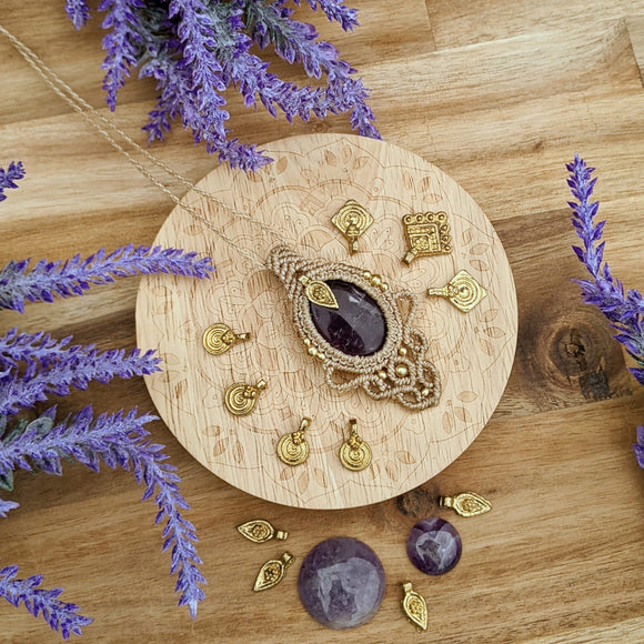 Handcrafted macramé pendant with an Amethyst gemstone centerpiece and brass details, perfect as a gift from a small business for hippie, and wellbeing-focused clients.