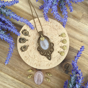 Handcrafted macramé pendant with a Rosa Quartz gemstone centerpiece and brass details, perfect as a gift from a small business for hippie, and wellbeing-focused clients.