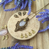 Handcrafted macramé pendant with a Rosa Quartz gemstone centerpiece and brass details, perfect as a gift from a small business for hippie, and wellbeing-focused clients.