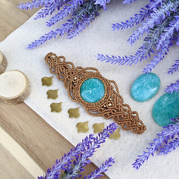 Handcrafted macramé bracelet with an Amazonite gemstone centerpiece and brass details, perfect as a gift from a small business for hippie, and wellbeing-focused clients.