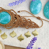 Handcrafted macramé bracelet with an Amazonite gemstone centerpiece and brass details, perfect as a gift from a small business for hippie, and wellbeing-focused clients.