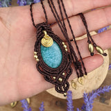 Handcrafted macramé pendant with an Amazonite gemstone centerpiece and brass details, perfect as a gift from a small business for hippie, and wellbeing-focused clients.