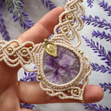 Handcrafted macramé necklace with an Amethyst gemstone centerpiece and brass details, perfect as a gift from a small business for hippie, spiritual, and wellbeing-focused clients.