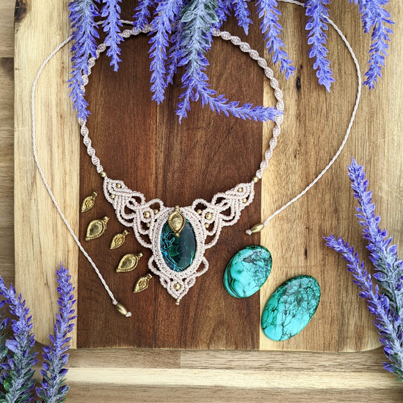 Handcrafted macramé necklace with an Chrysocolla gemstone centerpiece and brass details, perfect as a gift from a small business for hippie, spiritual, and wellbeing-focused clients.