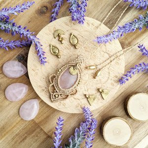 Handcrafted macramé pendant with a Rosa Quartz gemstone centerpiece and brass details, perfect as a gift from a small business for hippie, and wellbeing-focused clients.