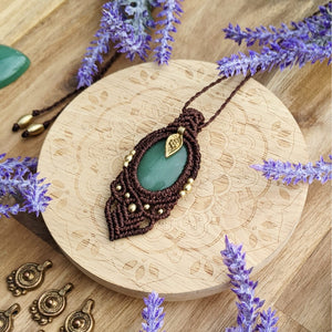 Handcrafted macramé pendant with an Aventurine gemstone centerpiece and brass details, perfect as a gift from a small business for hippie, and wellbeing-focused clients.