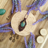 Handcrafted macramé pendant with an Aventurine gemstone centerpiece and brass details, perfect as a gift from a small business for hippie, and wellbeing-focused clients.