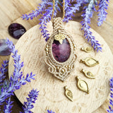 Handcrafted macramé pendant with an Amethyst gemstone centerpiece and brass details, perfect as a gift from a small business for hippie, and wellbeing-focused clients.