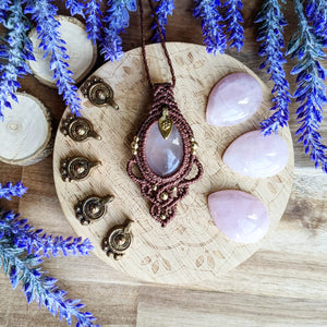 Handcrafted macramé pendant with a Rosa Quartz gemstone centerpiece and brass details, perfect as a gift from a small business for hippie, and wellbeing-focused clients.