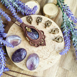 Handcrafted macramé pendant with an Amethyst gemstone centerpiece and brass details, perfect as a gift from a small business for hippie, and wellbeing-focused clients.