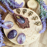 Handcrafted macramé pendant with an Amethyst gemstone centerpiece and brass details, perfect as a gift from a small business for hippie, and wellbeing-focused clients.