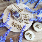 Handcrafted macramé pendant with an Amethyst gemstone centerpiece and brass details, perfect as a gift from a small business for hippie, and wellbeing-focused clients.