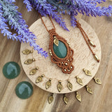 Handcrafted macramé pendant with an Aventurine gemstone centerpiece and brass details, perfect as a gift from a small business for hippie, and wellbeing-focused clients.