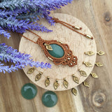 Handcrafted macramé pendant with an Aventurine gemstone centerpiece and brass details, perfect as a gift from a small business for hippie, and wellbeing-focused clients.