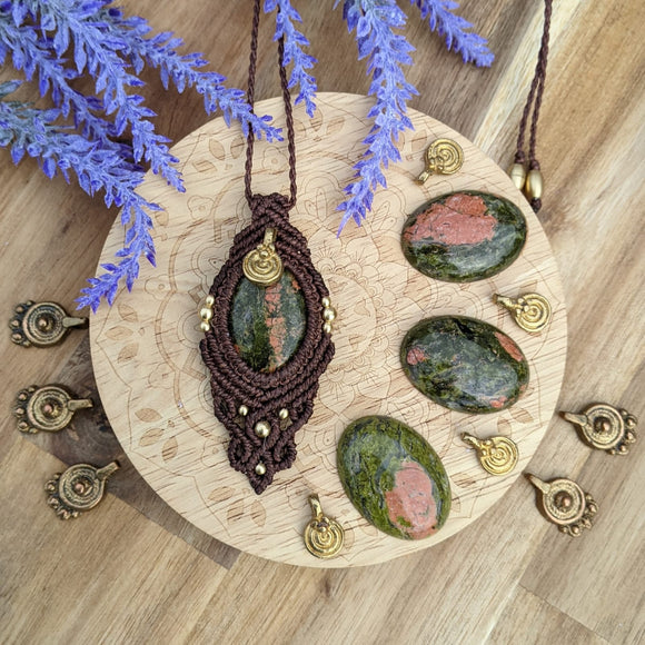 Handcrafted macramé pendant with an Unakite gemstone centerpiece and brass details, perfect as a gift from a small business for hippie, and wellbeing-focused clients.