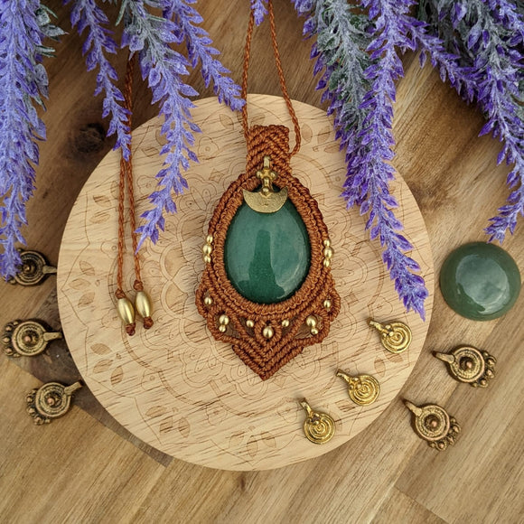 Handcrafted macramé pendant with an Aventurine gemstone centerpiece and brass details, perfect as a gift from a small business for hippie, and wellbeing-focused clients.