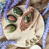 Handcrafted macramé pendant with an Unakite gemstone centerpiece and brass details, perfect as a gift from a small business for hippie, and wellbeing-focused clients.