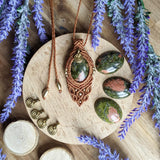 Handcrafted macramé pendant with an Unakite gemstone centerpiece and brass details, perfect as a gift from a small business for hippie, and wellbeing-focused clients.