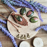 Handcrafted macramé pendant with an Unakite gemstone centerpiece and brass details, perfect as a gift from a small business for hippie, and wellbeing-focused clients.