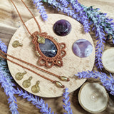 Handcrafted macramé pendant with an Amethyst gemstone centerpiece and brass details, perfect as a gift from a small business for hippie, and wellbeing-focused clients.