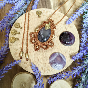 Handcrafted macramé pendant with an Amethyst gemstone centerpiece and brass details, perfect as a gift from a small business for hippie, and wellbeing-focused clients.