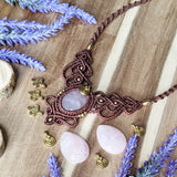 Handcrafted macramé necklace with a Rosa Quartz gemstone centerpiece and brass details, perfect as a gift from a small business for hippie, and wellbeing-focused clients.