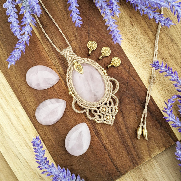 Handcrafted macramé pendant with a Rosa Quartz gemstone centerpiece and brass details, perfect as a gift from a small business for hippie, and wellbeing-focused clients.