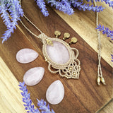 Handcrafted macramé pendant with a Rosa Quartz gemstone centerpiece and brass details, perfect as a gift from a small business for hippie, and wellbeing-focused clients.