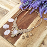 Handcrafted macramé necklace with a Rosa Quartz gemstone centerpiece and brass details, perfect as a gift from a small business for hippie, and wellbeing-focused clients.