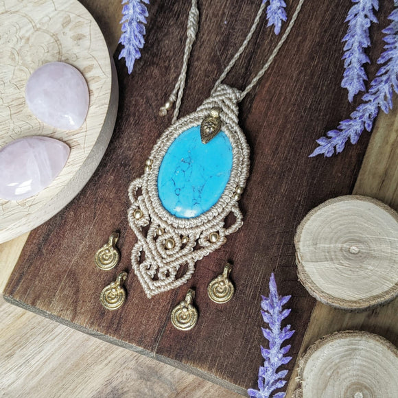 Handcrafted macramé pendant with a Dyed Magnesite gemstone centerpiece and brass details, perfect as a gift from a small business for hippie, and wellbeing-focused clients.