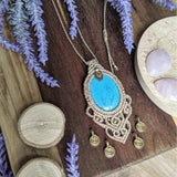 Handcrafted macramé pendant with a Dyed Magnesite gemstone centerpiece and brass details, perfect as a gift from a small business for hippie, and wellbeing-focused clients.