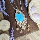 Handcrafted macramé pendant with a Dyed Magnesite gemstone centerpiece and brass details, perfect as a gift from a small business for hippie, and wellbeing-focused clients.