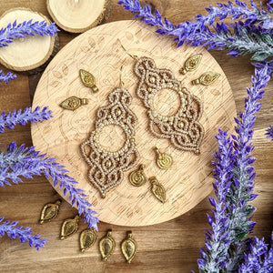 Handcrafted macramé earrings with brass details, perfect as a gift from a small business for hippie, and wellbeing-focused clients.