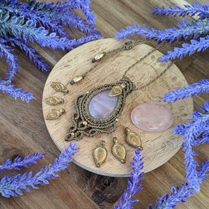 Handcrafted macramé pendant with a Rosa Quartz gemstone centerpiece and brass details, perfect as a gift from a small business for hippie, and wellbeing-focused clients.