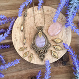 Handcrafted macramé pendant with a Rosa Quartz gemstone centerpiece and brass details, perfect as a gift from a small business for hippie, and wellbeing-focused clients.